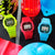 Cztery zegarki cyfrowe G-Shock w neonowych kolorach: żółtym, czerwonym i niebieskim z wyświetlaczem LCD.