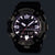 Zegarek męski z czarną kopertą, okrągłą tarczą z podświetlanymi cyframi i napisem G-SHOCK.