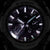 Zegarek męski Casio G-Shock, zbliżenie: czarna tarcza ze srebrnymi akcentami i oznaczeniami.