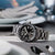 Citizen Herrenarmbanduhr auf Stoff, schwarzes Zifferblatt, silbernes Metallband